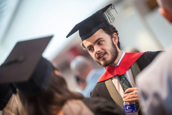 Male in graduation gown and hat