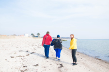 NWRC Student Union members walk along the beach